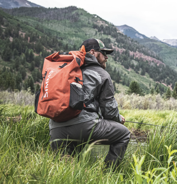 Simms Dry Creek Rolltop Backpack Action 2 Simms Dry Creek Rolltop Backpack Action 2